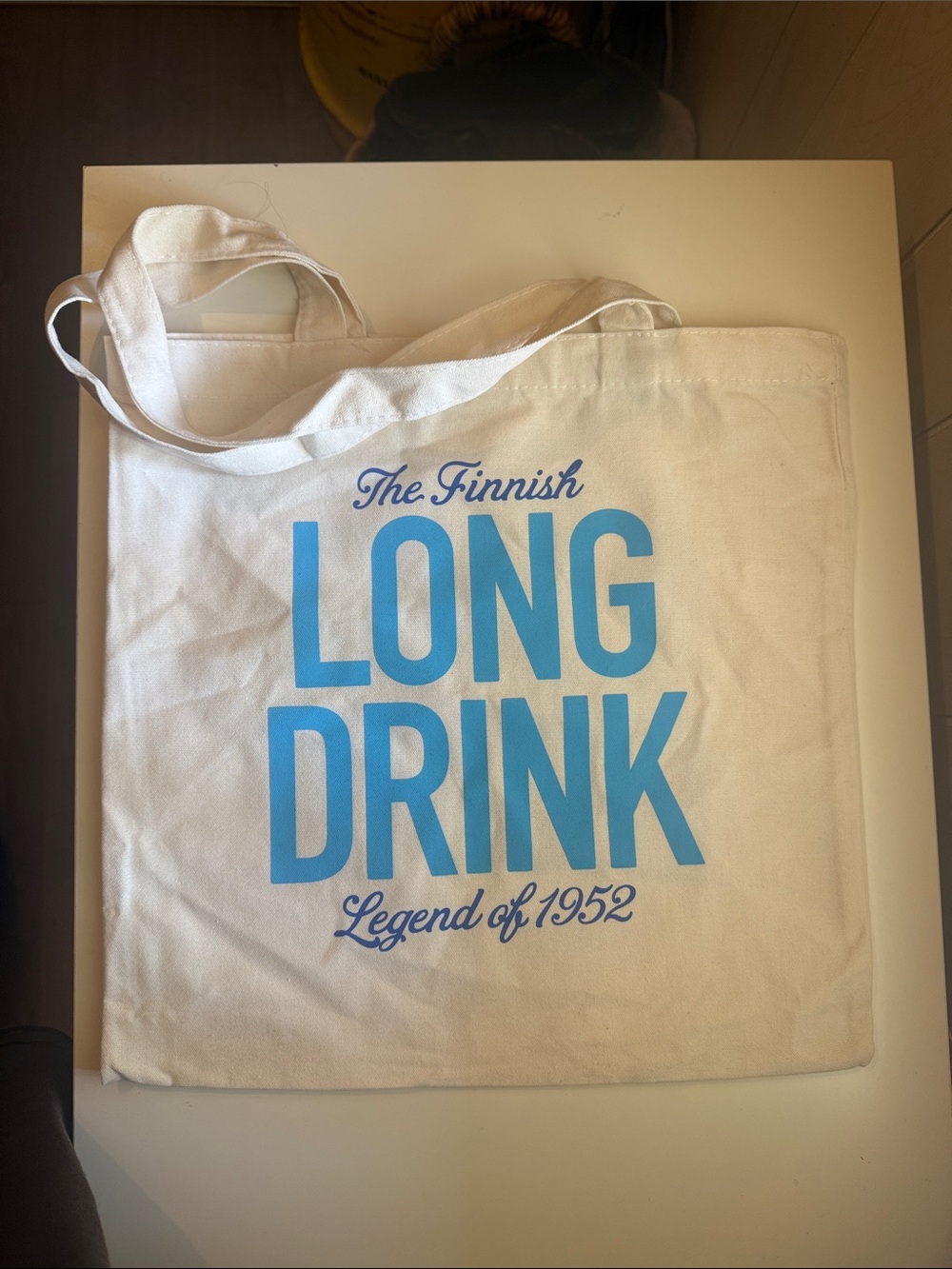 The Finnish Long Drink White Canvas Tote with Blue Print